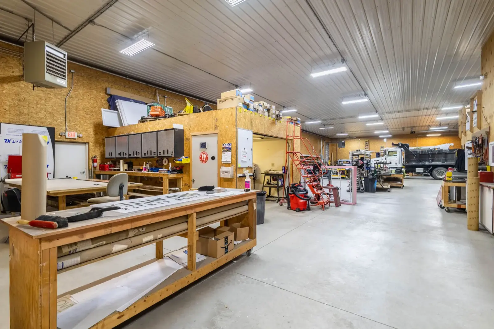Sign assembly workbenches and tools in the Signs Limited shop
