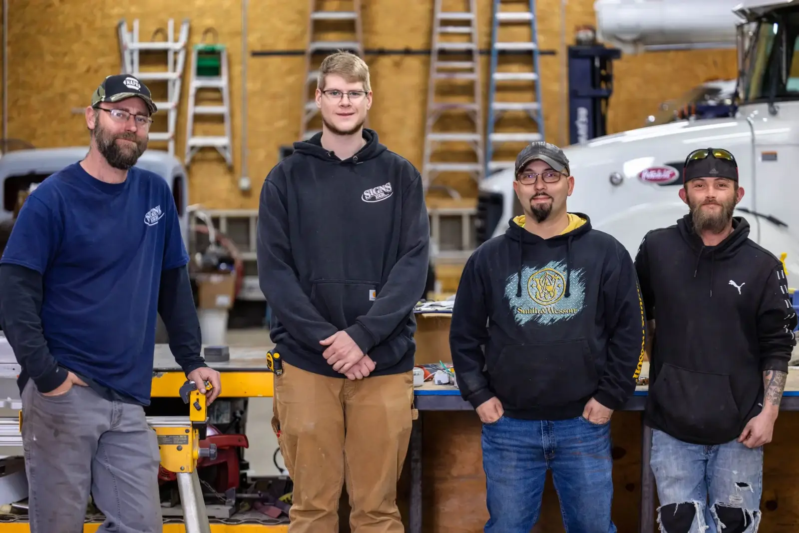 Members of the Signs Limited team in the Steubenville sign shop